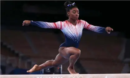  ??  ?? Simone Biles competes during the beam final at Tokyo 2020. Photograph: Xavier Laine/Getty Images