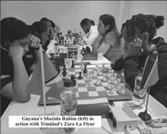  ?? ?? Guyana’s Shazida Rahim (left) in action with Trinidad’s Zara La Fleur