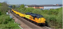  ?? Tom Mcatee ?? Colas Rail Freight’s 37057 Barbara Arbon leads 6Z37, the 10.15 Derby Railway Technical Centre to Toton, through Pride Park on April 18, delivering the latest Hawk JNA ballast boxes, converted from MRA side-tippers, to Network Rail following conversion at Loram UK in Derby.