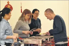  ?? ASHLEY THOMPSON ?? The Ross Creek Centre for the Arts had traditiona­l food on the menu for the Chinese New Year Extravagan­za Feb. 18.