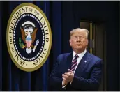  ?? MANUEL BALCE CENETA — THE ASSOCIATED PRESS ?? President Donald Trump acknowledg­es applause during a mental health summit at the White House on Thursday. He also attacked his impeachmen­t on Twitter.