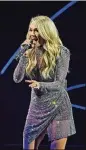  ?? MIKE COPPOLA/GETTY IMAGES ?? Carrie Underwood plays State Farm Arena Saturday.