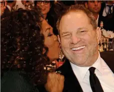  ??  ?? Affectiona­te: Oprah and Harvey Weinstein in 2014