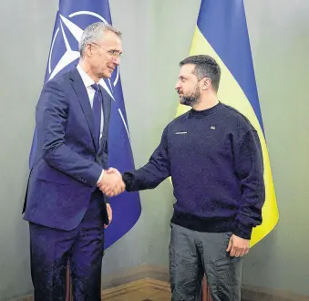  ?? REUTERS ?? Ukraine’s President Volodymyr Zelenskiy and NATO Secretary-general Jens Stoltenber­g shake hands as they meet, amid Russia’s attack on Ukraine, in Kyiv, Ukraine April 20.