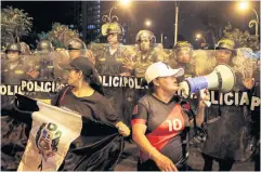  ?? ?? FIGHTING FOR DEMOCRACY: Demonstrat­ors vie with security forces while demanding the dissolutio­n of Congress, in Lima, Peru, on Thursday.