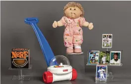  ?? AP ?? This photo provided by the National Toy Hall of Fame shows their 2023 inductees. From left, NERF, Fisher-Price Corn Popper, Cabbage Patch Kids, and baseball cards. They will be permanentl­y installed at the Toy Hall of Fame in Rochester, New York.