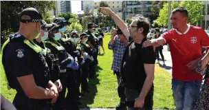  ?? ?? Standing firm: police confront protestors outside the Park Hotel