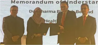  ??  ?? Leonard (second right) exchanges the MOU with KPJ Healthcare executive director Jasimah Hassan (second left). Looking on are Pharmaserv Alliances Sdn Bhd general manager Zainal Abidin Lajat (left) and Duopharma Biotech chief operating officer Wan Amir-Jeffret Wan Abdul Majid.