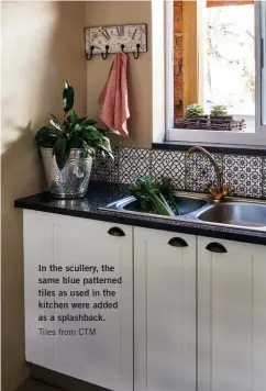  ??  ?? In the scullery, the same blue patterned tiles as used in the kitchen were added as a splashback. Tiles from CTM