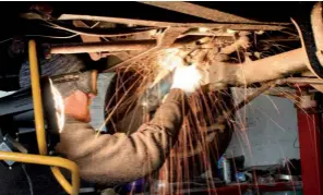  ??  ?? Richard at Herbie Hospital prepares the space between the front beams for mounting the brake servo.