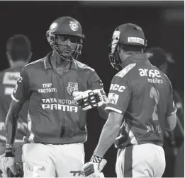  ?? BCCI ?? Kings XI Punjab’s Akshar Patel and George Bailey during their IPL- 7 game against Delhi Daredevils in New Delhi on Monday. Kings won by four wickets. —