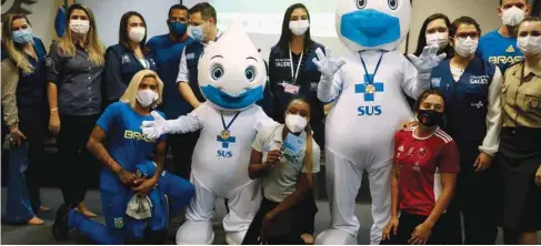  ??  ?? Brazilian athletes and staff travelling to Tokyo for the Olympics pose after receiving their Pfizer-BioNTech coronaviru­s disease (COVID-19) vaccine yesterday.