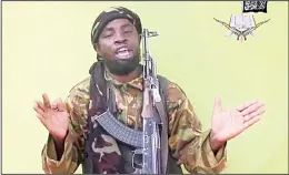  ??  ?? In this May 12, 2014 file photo taken from video by Nigeria’s Boko Haram terrorist network, shows their leader Abubakar Shekau speaking to the camera. Boko Haram leader Abubakar Shekau is believed to be fatally wounded in an airstrike while he was...