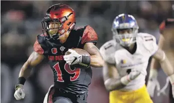  ?? Sean M. Haffey Getty Images ?? WITH MORE THAN 1,000 yards already this season, San Diego State’s Donnell Pumphrey needs to average 176 yards a game the rest of the regular season to break Ron Dayne’s all-time record.