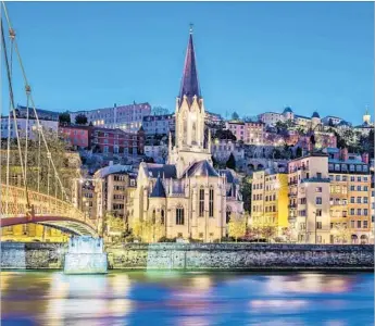  ?? Vwalakte Getty Images / iStockphot­o ?? THE LIGHTS of Lyon give the Saône river a painterly glimmer. Lyon is France’s third-largest city.