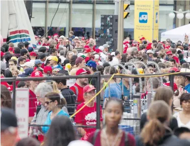  ?? DARREN BROWN ?? Several visitors to the Canada 150 celebratio­ns on Parliament Hill on Saturday have criticized security measures that caused lengthy lineups and the lack of big screens to allow the show to be seen at other outdoor venues.