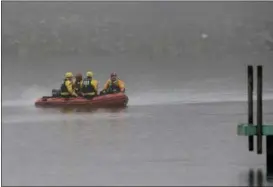  ?? ASSOCIATED PRESS FILE ?? A boat carrying a recovery team rides on the shoreline of Lake Erie in Cleveland in December.