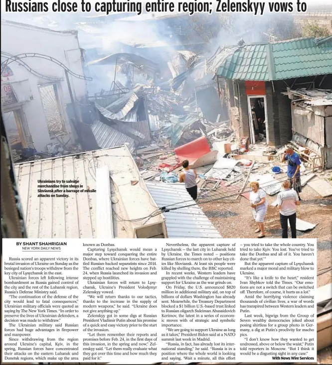  ?? ?? Ukrainians try to salvage merchandis­e from shops in Sloviansk after a barrage of missile attacks on Sunday.