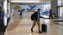  ?? TY GREENLEES / STAFF ?? Renovation­s to the check-in area of the Dayton Airport terminal has been completed with terrazzo floors, full glass and steel exterior and a glass canopy to allow for more natural light.