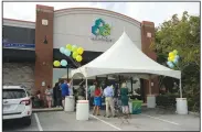  ?? NWA Democrat-Gazette/ANDY SHUPE ?? Customers wait in line Saturday at Acanza as the first medical marijuana dispensary in Fayettevil­le opens for the first time.