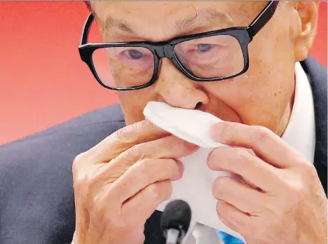  ?? KIN CHEUNG/THE ASSOCIATED PRESS ?? Billionair­e Li Ka-shing had an emotional moment Wednesday as he recalled his 67 years working in Hong Kong.