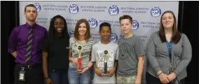  ?? STAFF PHOTO BY JAMIE ANFENSON-COMEAU ?? From left, Matthew Henson Middle School MESA sponsor Brian Palko, prosthetic arm team members Simone McCarter-Dodzie, Shelby Hiens, Charles Martin and Justin Stewart, and sponsor Kaitlyn Whitfield, with the first place trophies the team won in the...