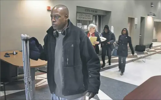  ?? Post-Gazette ?? Cecil Douglas, 58, heads to City Court on Friday to attend the preliminar­y hearing for Martell Smith, who is charged with setting a fire that killed Mr. Douglas’ wife, another woman and a 4-year-old girl Dec. 20. Mr. Douglas jumped from the roof to...