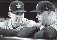  ?? Karen Warren / Staff photograph­er ?? Dave Hudgens, left, of the Blue Jays, the Astros’ hitting coach in 2017, is the latest to apologize for the scheme in which Carlos Beltran, right, had a large role.