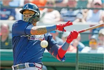  ?? AP PHOTO/JOHN RAOU ?? Atlanta Braves’ Orlando Arcia fouls a pitch in the first inning against the Detroit Tigers on Wednesday in Lakeland, Fla.