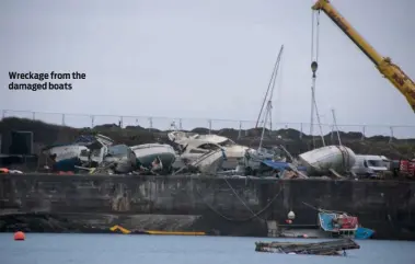  ??  ?? Wreckage from the damaged boats