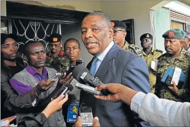  ?? Picture: AFP ?? FACING THE MUSIC: Executive Secretary of the Internatio­nal Conference of the Great Lakes Region ambassador Zachary Muburi-Muita speaks to the media after launching an intelligen­ce nerve centre on Saturday in Kasese District, about 340km west of the...
