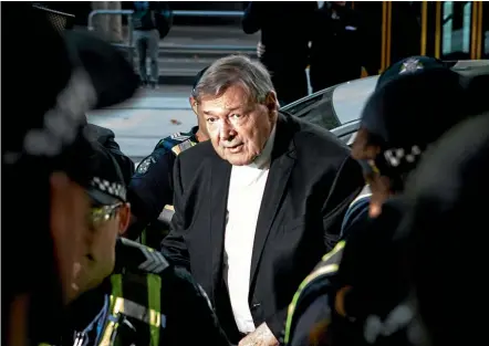  ?? FAIRFAX ?? Cardinal George Pell arrives at Melbourne Magistrate­s Court for a decision on whether he is committed to trial on sexual assault charges.