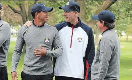  ?? CHICAGO TRIBUNE FILE PHOTO ?? Tiger Woods, left, Jim Furyk and Jason Dufner are pictured Sept. 25, 2012, in Medinah, Ill. The U.S. team posed for a photo before the first day of practice at the 39th Ryder Cup.