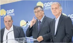  ?? ?? SUBJECT OF INQUIRY: Brasilia governor Ibaneis Rocha, left, attends a news conference at government headquarte­rs in Brasilia, Brazil on Dec 27.