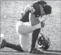  ??  ?? Michigan’s Adam Shibley takes a knee after the Wolverines lost to the Spartans on Saturday at Michigan Stadium.