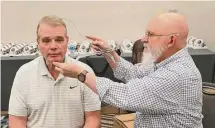  ?? Bruce Yeung/Getty Images ?? Former Jets defensive lineman Joe Klecko sits still as he is measured by sculptor Blair Buswell during the Bronze Bust Measuremen­t at the Pro Football Hall of Fame Sizing Saturday Event last weekend in Phoenix.