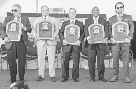  ?? GREGORY J. FISHER, USA TODAY SPORTS ?? Baseball’s Hall of Fame Class of 2017, from left: former commission­er Bud Selig, catcher Ivan Rodriguez, front office guru John Schuerholz, outfielder Tim Raines and first baseman Jeff Bagwell.