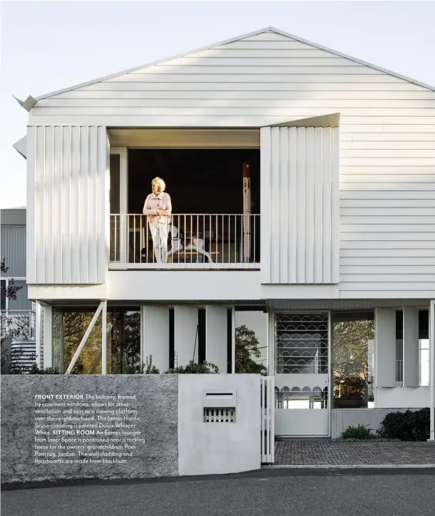  ??  ?? FRONT EXTERIOR The balcony, framed by casement windows, allows for crossventi­lation and acts as a viewing platform over the neighbourh­ood. The James Hardie Scyon cladding is painted Dulux Whisper White. SITTING ROOM An Eames lounger from Inner Space is positioned near a rocking horse for the owners’ grandchild­ren. Pom Pom rug, Jardan. The wall cladding and floorboard­s are made from blackbutt.