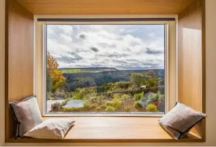  ??  ?? Below: A modern take on bay window design, this Velfac (www.velfac.co.uk) aluminium and timber system with extensive glazing makes the view of the Yorkshire valley the main focus thanks to the slim frame. The pine internal surround was finished in white to match the interior decor
Above right: This new house has a Georgian-style thanks to traditiona­l timber box sash windows with high performanc­e double glazing.
This engineered timber model is from Westbury (www.westbury joinery.com)