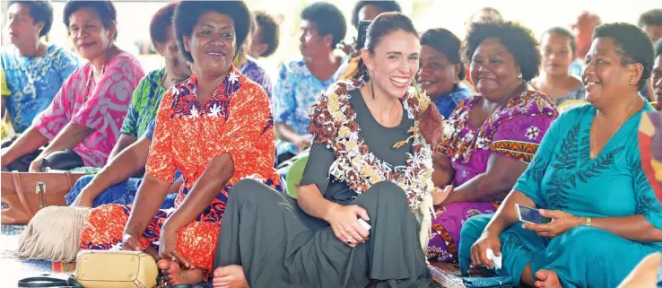 ?? Photo: Ronald Kumar ?? New Zealand Prime Minister Jacinda Ardern with women from Tamavua-i-Wai Village dring her visit on February 26, 2020.