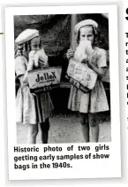  ??  ?? Historic photo of two girls getting early samples of show bags in the 1940s.