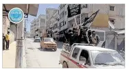  ?? AL-NUSRA FRONT TWITTER PAGE ?? Nusra Front fighters wave their group’s flags. Al-Qaida’s branch in Syria has recruited hundreds of new fighters, illustrati­ng how a cease-fire has in many ways backfired.