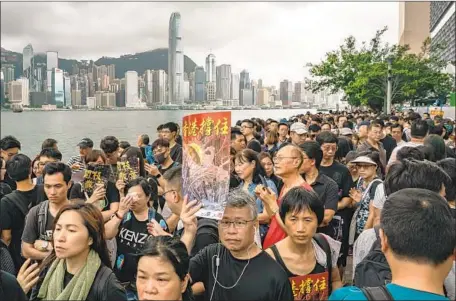  ?? Anthony Kwan Getty Images ?? PROTESTERS take part in a demonstrat­ion Sunday in Hong Kong over the extraditio­n bill, which set off a month of mass protests.