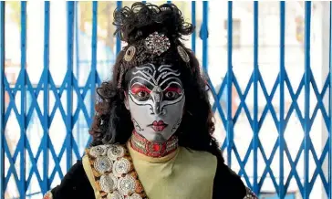  ?? PHOTO: REUTERS ?? A boy dressed as Hindu Lord Shiva poses before performing in a religious procession at the Mahashivra­tri festival in Allahabad.