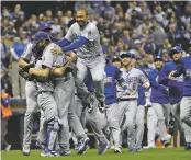  ?? MATT SLOCUM ASSOCIATED PRESS ?? The Dodgers celebrate after Game 7 of the National League Championsh­ip Series on Saturday in Milwaukee. The Dodgers won 5-1 to win the series and will face the Red Sox in the World Series, which begins Tuesday.