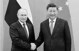  ?? RAMIL SITDIKOV/SPUTNIK ?? Russian President Vladimir Putin and China’s President Xi Jinping held a virtual summit Wednesday. Above, the leaders at a 2019 summit in Brazil.