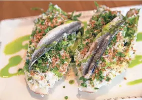  ?? COMMERCIAL APPEAL ?? The Little Gem Caesar features white anchovy, Old Bay breadcrumb­s and Caesar on April 1 at Fancy’s Fish House in Memphis.
