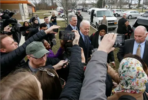  ?? Paul Vernon/Associated Press ?? Democratic presidenti­al candidate former Vice President Joe Biden speaks with reporters Tuesday as he leaves a campaign event in Columbus, Ohio.
