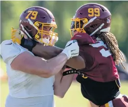  ?? ALEX BRANDON/ASOCIATED PRESS ?? Washington offensive tackle Paul Adams (79) and rookie defensive end Chase Young (99), the 2020 draft’s No. 2 pick, practice at the team’s training facility in Ashburn on Aug. 18.