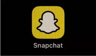  ?? ?? The icon for instant messaging app Snapchat is seen on a smartphone.